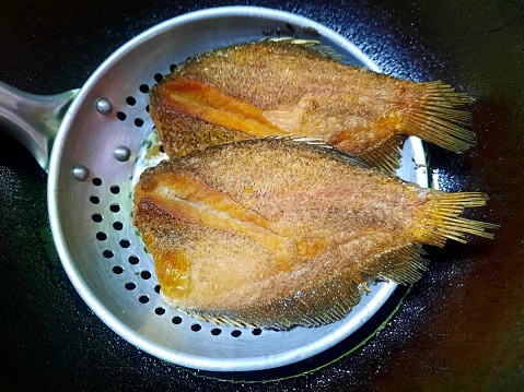 Deep Fried Snakeskin Gourami fish - food preparation.