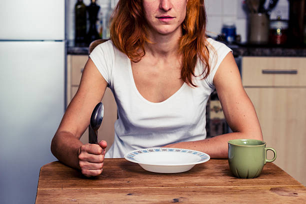 istock Woman about to have breakfast in kitchen 180152006