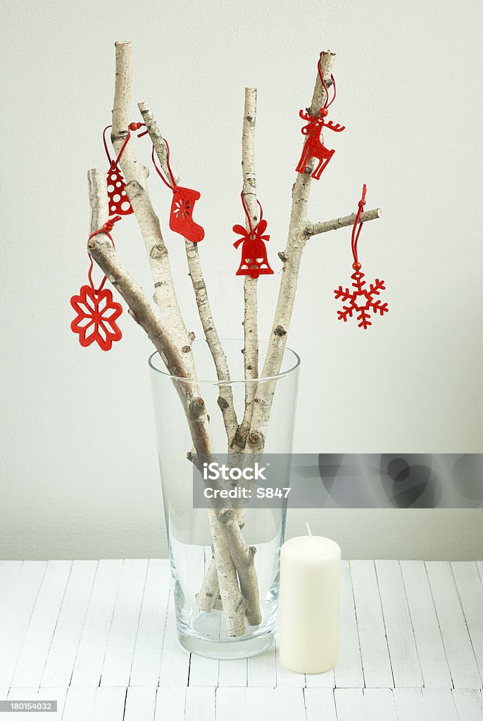 Alternative christmas tree environmentalist christmas tree from white birch twigs, with red felt ornaments on bright wooden table Birch Tree Stock Photo