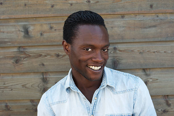istock Portrait of an attractive black man smiling 180154845
