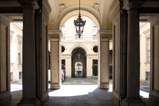 Turin, Italy – Aug 3, 2023 – Architectural detail of the portals within Piazza San Carlo, a central square celebrated for its Baroque architecture.