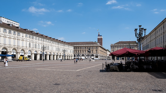 Turin, Italy – Aug 3, 2023 – View of Piazza San Carlo, a central square celebrated for its Baroque architecture, with the 1838 Equestrian monument of Emmanuel Philibert set amidst 1638-designed porticos.