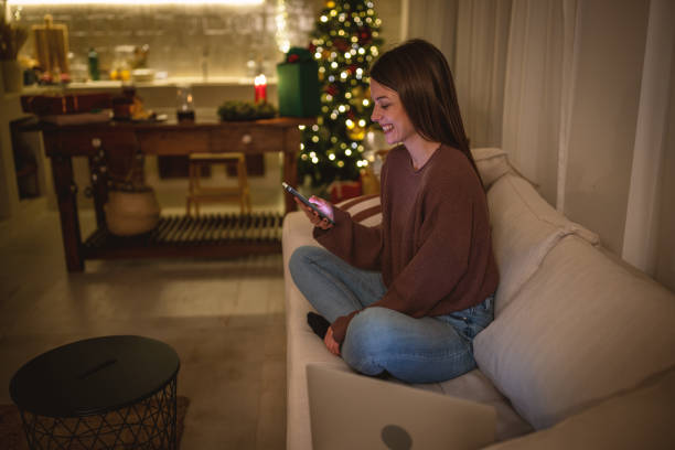 istock Young woman using phone on a New Year's eve. 1801567027
