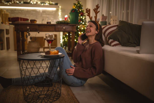 istock Young woman using mobile phone on New Year's eve 1801567886