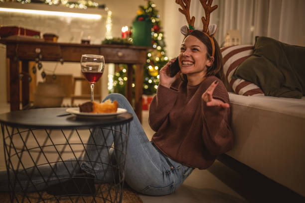 istock Young woman using mobile phone on New Year's eve 1801567900