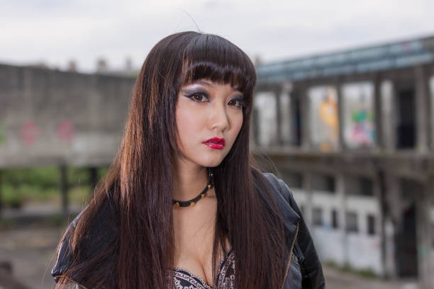 istock Asian woman in emo goth clothes at an abandoned building 1801591376