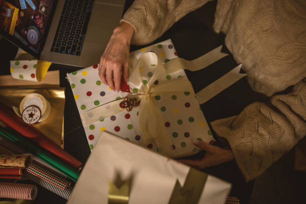 istock Wrapping a Christmas gifts at home 1801597670