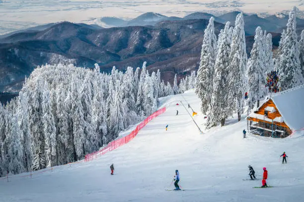 Photo of Skiers on the spectacular ski slope, Carpathians, Romania