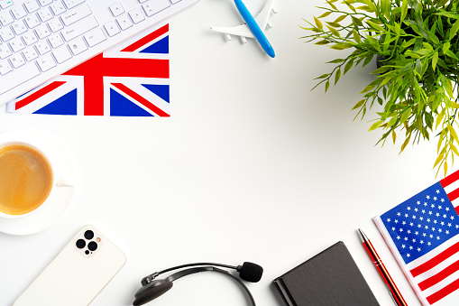 Flag of Great Britain and stationery on white background top view