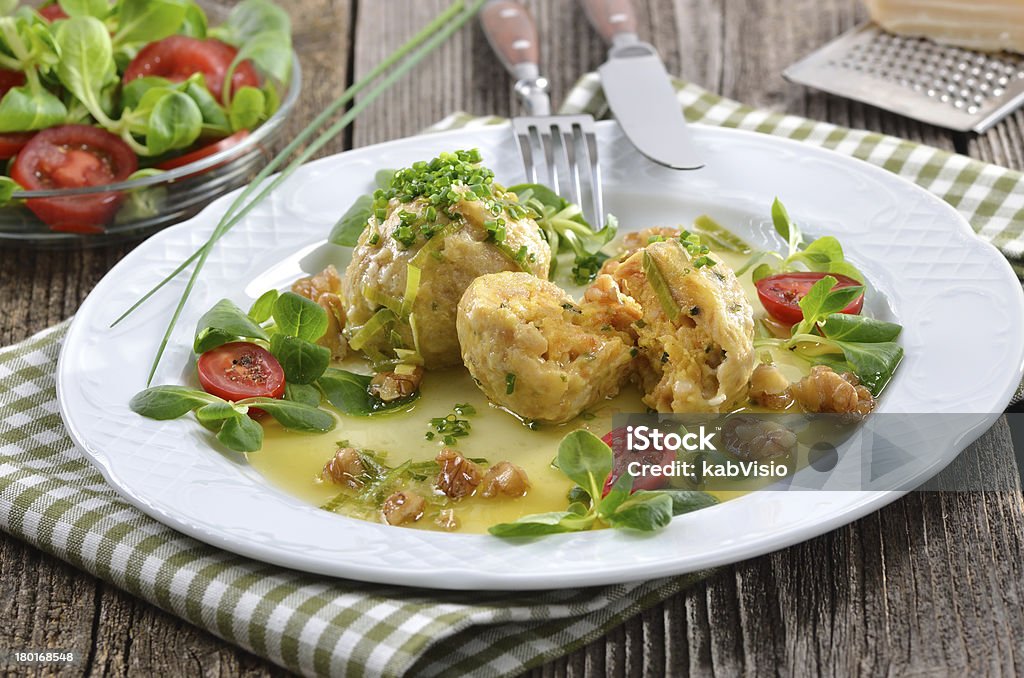 Cheese dumplings South Tyrolean bread dumplings with grey cheese, served with butter and walnuts Austrian Culture Stock Photo