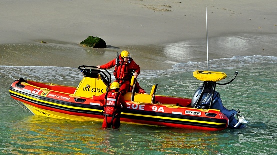 Cape Town , South Africa- 05 August 2023. Photo of a Rescue team on a motor boat in the Ocean in Gordon's Bay, South Africa