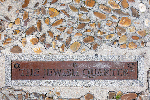 Metal sign on the entrance of jewish quarter in Toledo