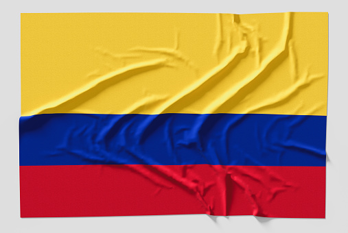 Flag of Colombia. Fabric textured Colombia flag isolated on white background. 3D illustration