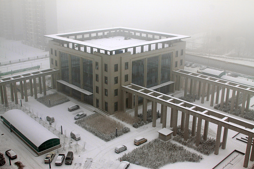 TANGSHAN CITY - JANUARY 16: The buildings in the fog and snow on january 16, 2014, tangshan, china.