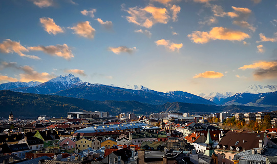 The cityscape view in Innsbruck  as city center town with beautiful houses, river Inn and Tyrol Alps, Austria