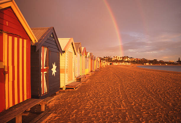 Beach Boxes with Rainbow stock photo