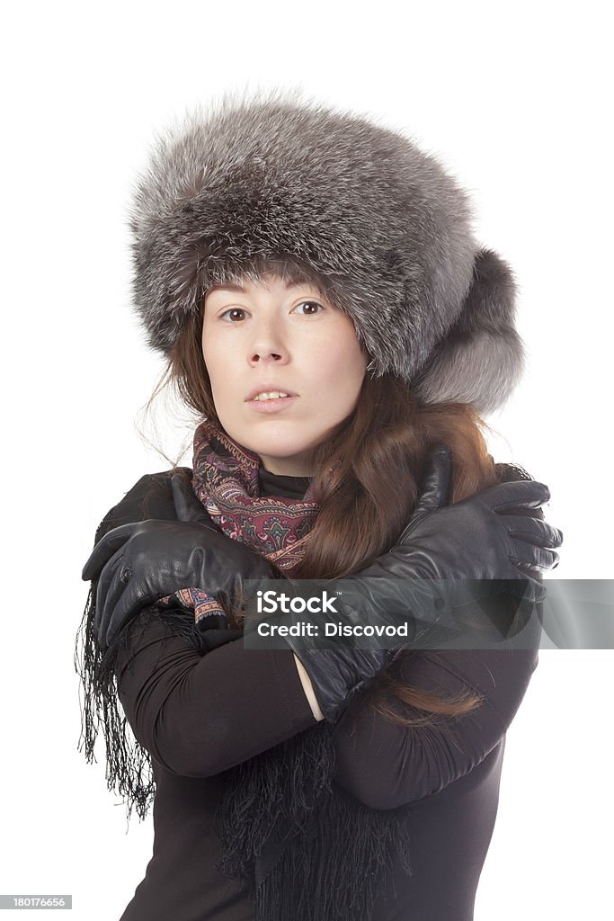 Vivacious woman in winter outfit Vivacious woman in a winter outfit with a fur hat on white background Adult Stock Photo