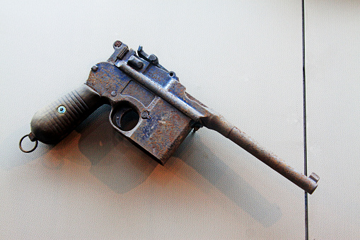 original abandoned pistol in a museumj, closeup of photo