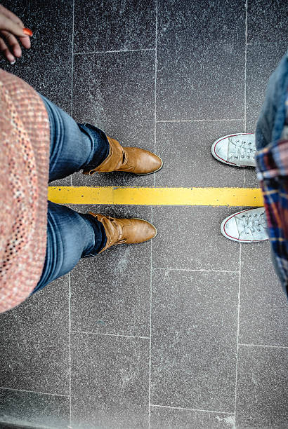 istock two people stand in front of each other 180177194