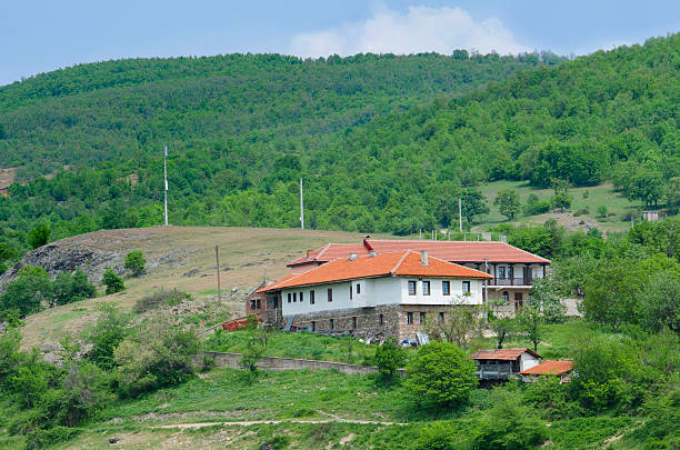 istock Fantastic monastery complex near ld church in the mountain landscape 180177281