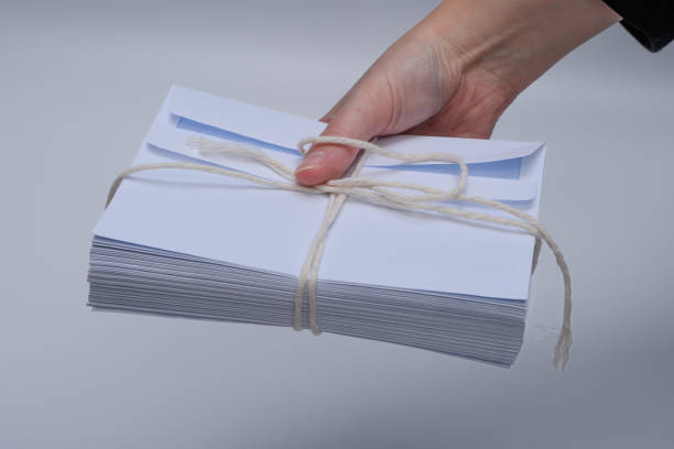 istock Hold a stack of old enveloped letters in your hand 1801784541
