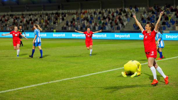 istock Soccer female player scoring a goal 1801794384
