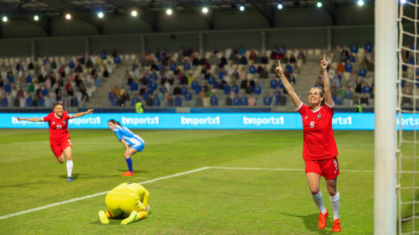 istock Soccer female player scoring a goal 1801794387