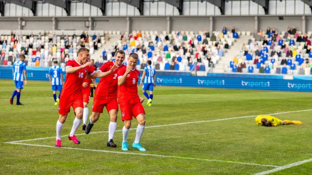 istock Soccer players team scoring a goal 1801794389