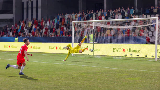 istock Soccer female player scoring a goal 1801794390