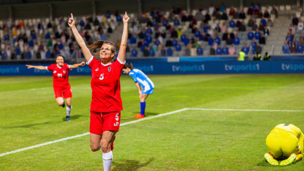 istock Soccer female player scoring a goal 1801794394