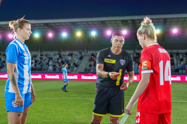 istock Soccer team captains flipping coin 1801794403