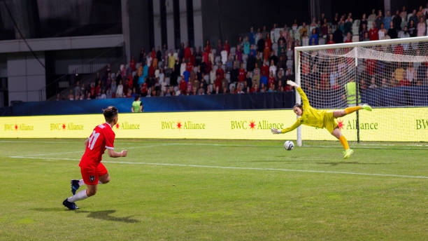 istock Soccer female player scoring a goal 1801794408