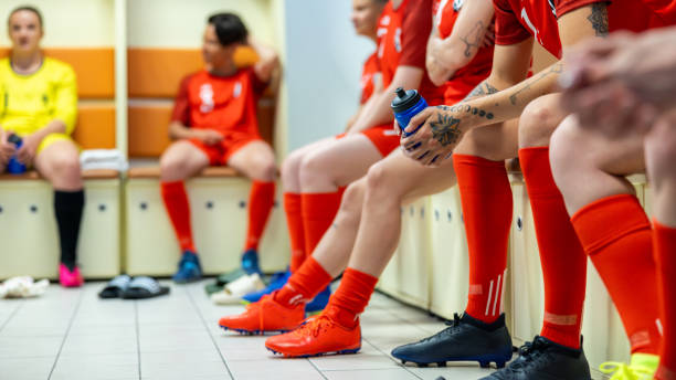 istock Soccer team in locker room, legs medium shot 1801794419