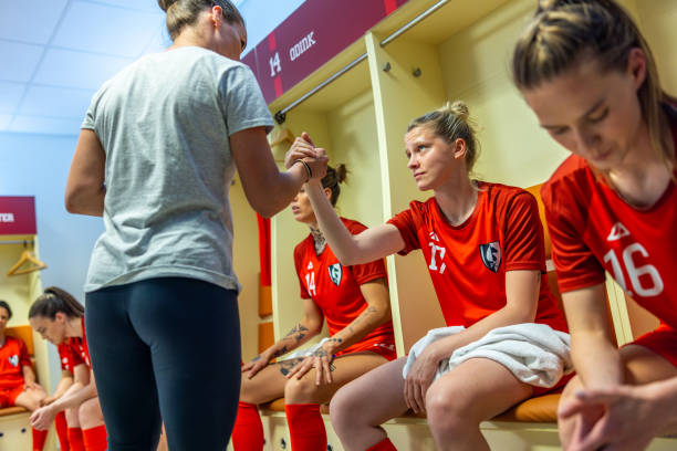 istock Soccer coach shaking hands with player 1801794420