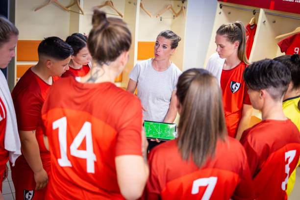 istock Football trainer showing players positioning on tablet 1801794705