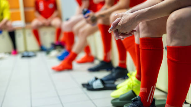 istock Soccer team in locker room, legs medium shot 1801794914