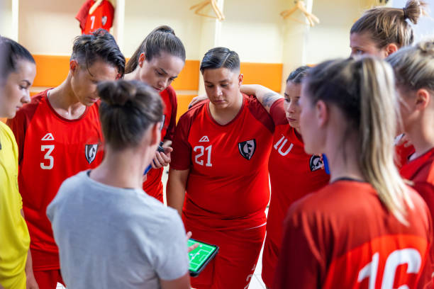istock Soccer coach showing players positioning on tablet 1801794938