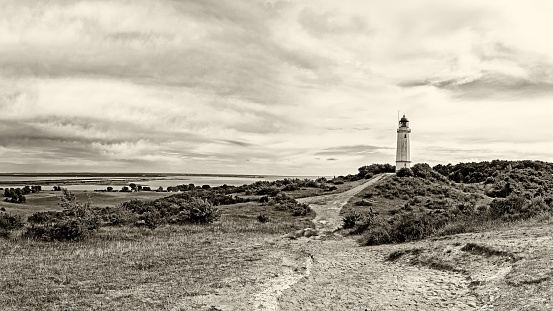 Panorama of the landscape on the island of Hiddensee, located in the Baltic Sea, with the lighthouse Dornbusch, Germany, sepia toned