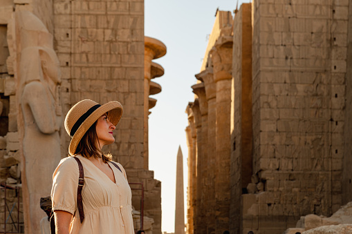 woman at the Karnak temple in Egypt in Cairo near the Nile River