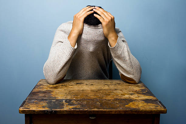 istock Young man hiding in his jumper 180180855
