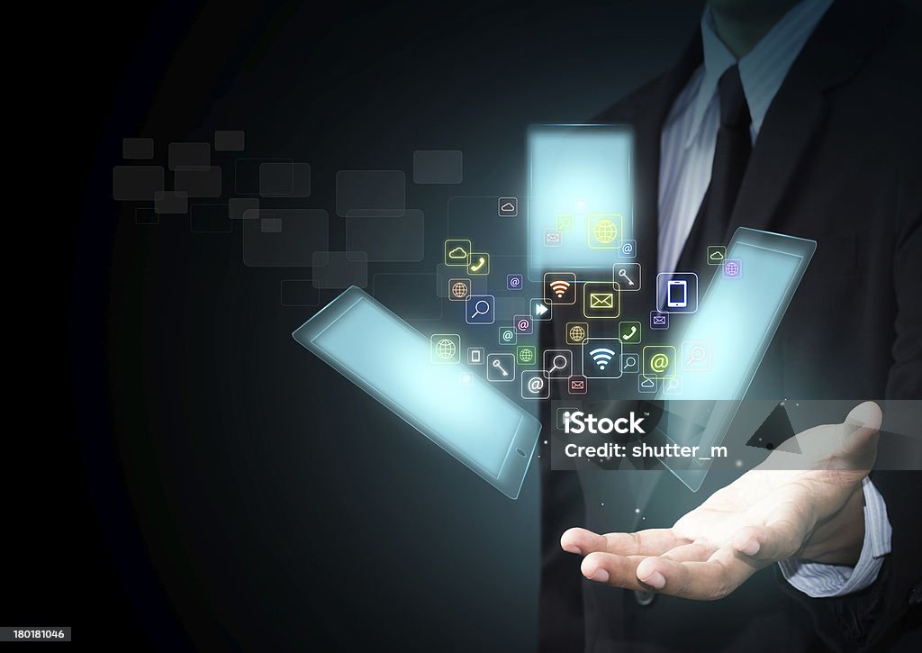 Touch screen tablet Touch screen tablet with cloud of colorful application icons Business Stock Photo