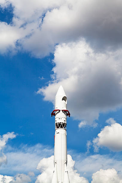 istock Vostok spacecraft and blue sky with clouds 180181685