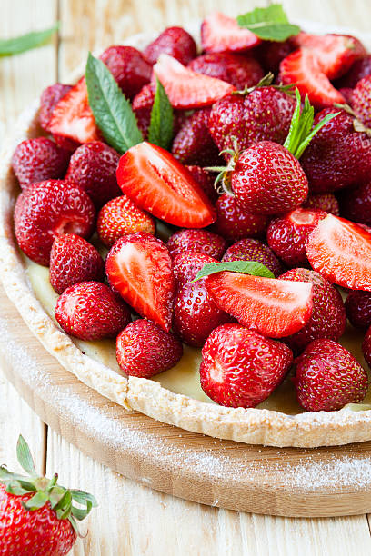 istock tart with custard and fresh strawberries 180184481