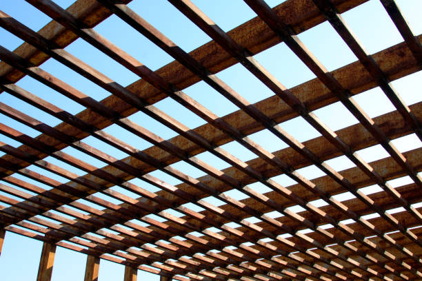 Oxidation rust steel beams in blue sky background, closeup of photo