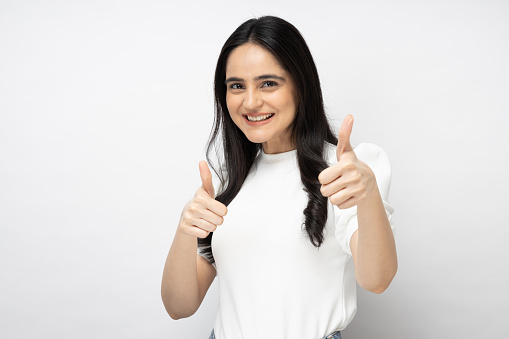 Portrait of young girl, copy space isolated over white background