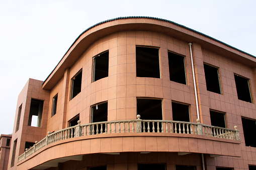 Unfinished buildings in a park, closeup of photo