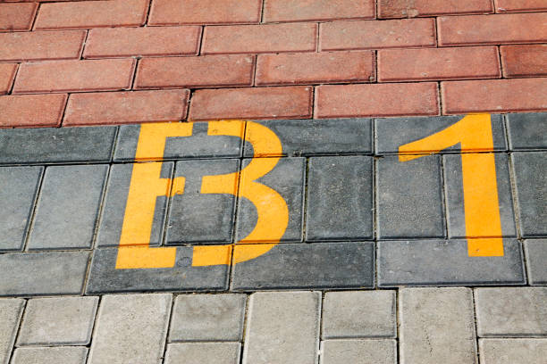 yellow numbers on color cement block, closeup of photo