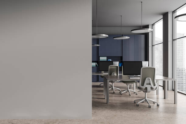 istock Blue and gray open space office with blank wall 1801913720