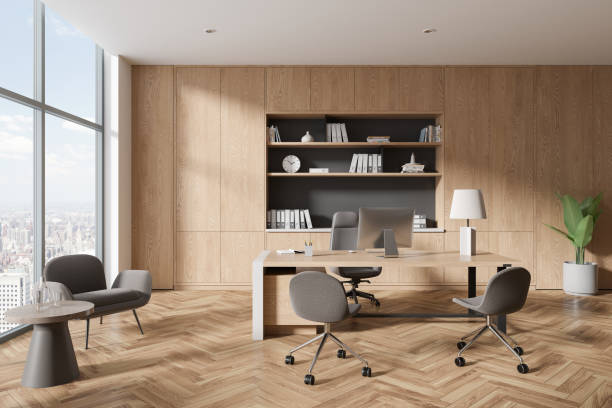 istock Wooden office interior with work desk, chill zone and panoramic window 1801915312