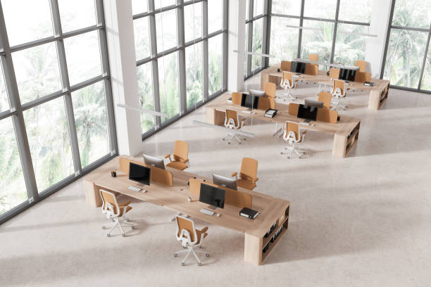 istock Top view of office workplace interior with pc computers and chairs in row 1801918542